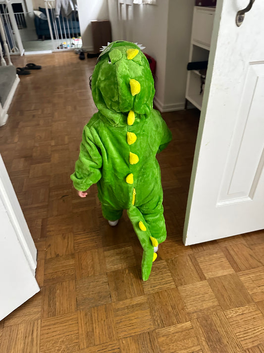 Here’s a photo of him living his best life in his dinosaur costume!